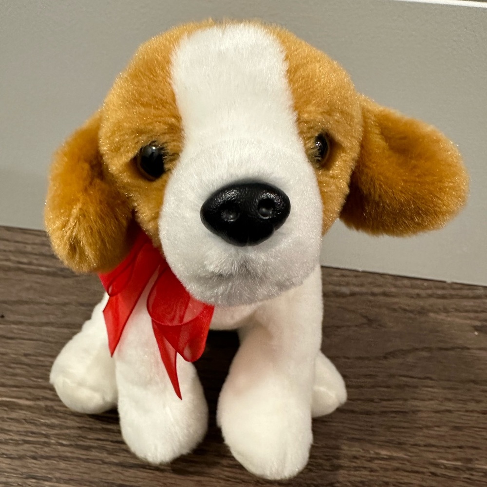 Beagle dog with a red ribbon by Evergreen.